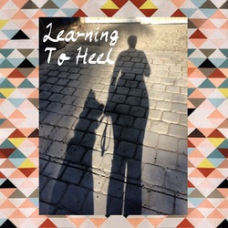 Shadows of a person walking a dog with the words Learning To Heel